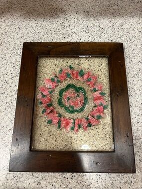 vintage lace doily mounted inside a wooden frame